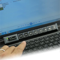 X-keys XK-8 controlling Media Player on a laptop